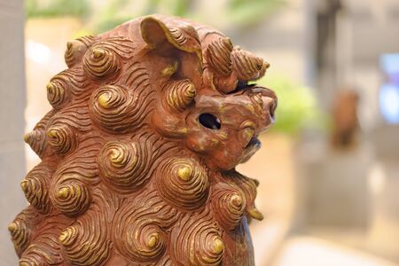 Okinawan Shisa lion sculpturein the American Village neighborhood of Chatan City in Okinawa.の写真素材