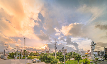 Naha, Japan - September 15, 2018: Sunrise on the giant stone dragon head of the pillars that greet the ship Naha Harbor Cruise Terminal dock, Naha and Fuzhou symbol of sister cities in China.