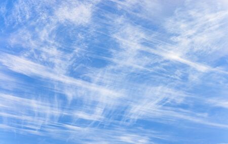 blue sky and fine and slightly brushed cirrus clouds announcing a typhoon over the sky of tokyo.の写真素材