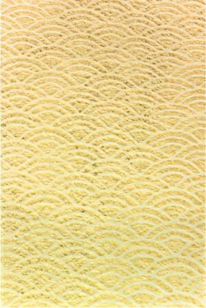 A Japanese greeting card with a traditional lace circles motif pattern on a golden paper background.の写真素材