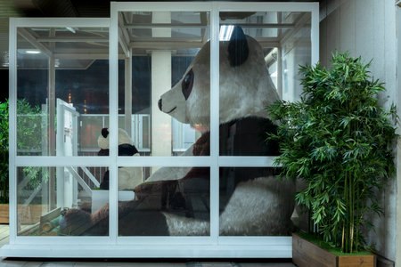 tokyo, japan - january 07 2020: Giant plush doll panda in a show window at the Iriya exit of the Ueno station in Tokyo, Japan.のeditorial素材