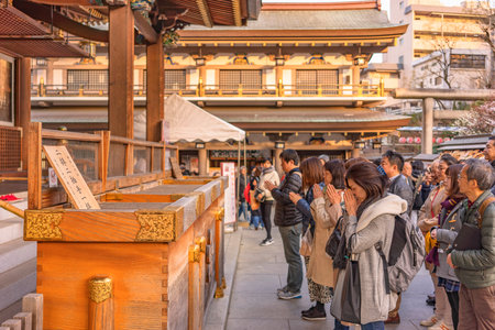 tokyo, japan - march 02 2020: Japanese queuing and praying in the Yushima shrine of Tokyo dedicated to the god of studies Sugawara no Michizane.のeditorial素材