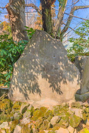 tokyo, japan - march 05 2020: Stone monument depicting three of the seven Japanese gods of happiness, Ebisu god of fishermen, Daikokuten god of kitchen and Benzaiten goddess of art in the Atago temple of Tokyo.のeditorial素材