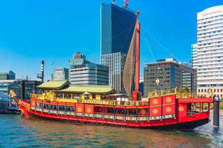 tokyo, japan - april 04 2020: Red Gozabune sailboat replicates luxury yachts used in the Edo period for Tokugawa emperors or shoguns used as a restaurant and moored at the Hinode pontoon in Tokyo.のeditorial素材