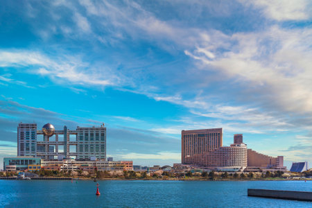 tokyo, japan - mars 04 2020: Panoramic seascape of Odaiba island with Aqua City shopping centers, building of the Fuji TV famous for its Hachitama observation sphere and Hilton or Grand Nikko hotels.のeditorial素材