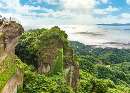 Cliffs of the ancient stone quarry of mount Nokogiri with an observatory jutting out over the void on a stunning panoramic vantage point overlooking the Boso Peninsula.の写真素材