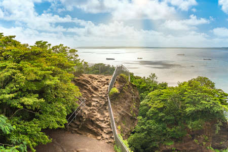 Observatory of Jigoku Nozoki meaning Peep into Hell on the cliff of the Mount Nokogiri stone quarry overlooking the Uraga Channel where tanker boats are sailing.の写真素材