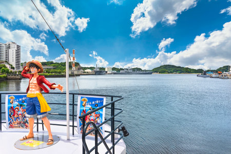 yokosuka, japan - july 19 2020: Wide angle view of the real size figurine of the hero Monkey D. Luffy from the manga One Piece by Eiichiro Oda standing on the cruise boat of the Yokosuka naval port.のeditorial素材