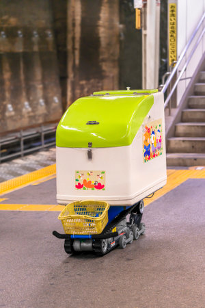 tokyo, japan - October 25 2020: Stair climbing equipment used for garbage collection and transportation using an electric trolley with caterpillar elevator in a japanese train station.のeditorial素材