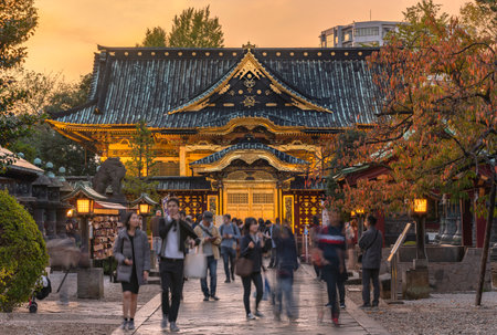 tokyo, japan - november 10 2019: Lanterns illuminating the gold foils covered Ueno TÅshÅ-gÅ« shrine classed as Important cultural property for its Karahafu curved gable architecture at sunset.のeditorial素材