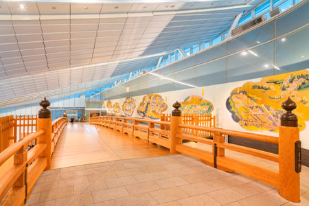 tokyo, japan - november 22 2020: Traditional haneda-nihonbashi wooden bridge ornated with a giboshi finial along a porcelain maiden screen in the Edo Market Place of the Haneda International Airport.のeditorial素材