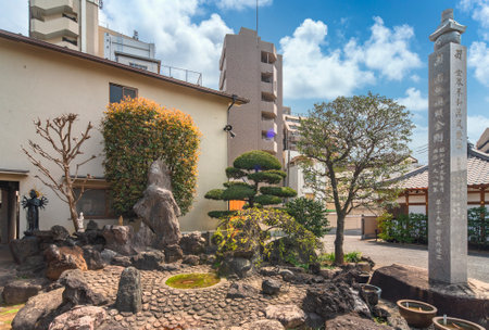 tokyo, japan - april 05 2020: Inner stone garden of the Togakuji temple with a commemorative Kuyo column in tribute to the 1150th anniversary of the death of monk Kukai, founder of the Shingon sect.のeditorial素材