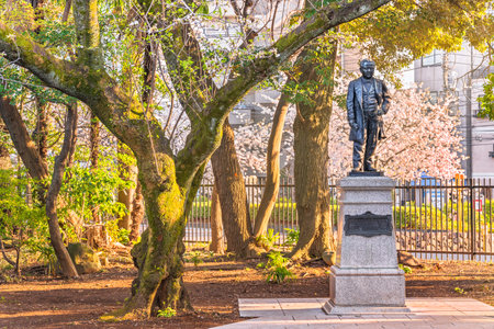 tokyo, japan - march 23 2021: Bronze statue of the Japanese father of capitalism Shibusawa Eiichi by Naganuma Moriyoshi in the museum of Asukayama park in springtime.のeditorial素材