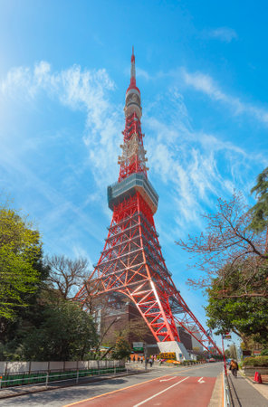tokyo, japan - april 06 2019: Slope of Tokyo Tower street at foot of the tallest lattice tower of Japan inspired by the design of the Eiffel Tower and painted in international orange color.のeditorial素材