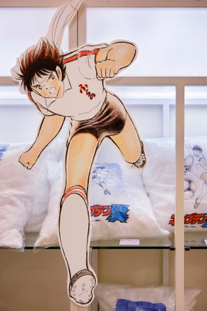 tokyo, japan - May 04 2018: Life sized standee of the running soccer player Hikaru Matsuyama from Japanese sport manga Captain Tsubasa against a shelf with pillows in a fashion store of Tokyo Skytree.のeditorial素材