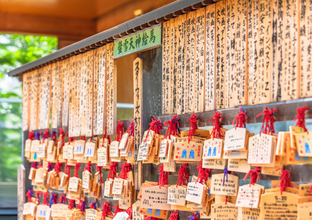 tokyo, japan - may 03 2021: Shinto Ema votive plaques dedicated to Keisetsu tenjin deity below movie titles like star wars in center inscribed by producers to pray for success in the Akagi Shrine.のeditorial素材