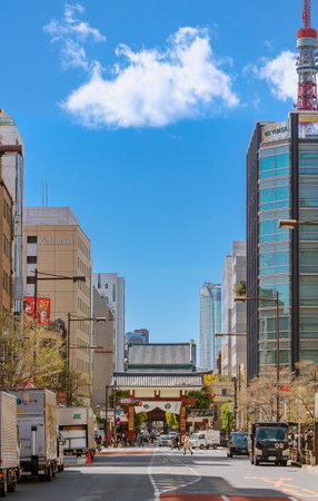 tokyo, japan - april 09 2021: Takeshiba street leading to the Shibadaimon or kouraimon portal which is the ancient gate of the Buddhist Zojoji temple adorned with the family crest of Tokugawa Shoguns.のeditorial素材