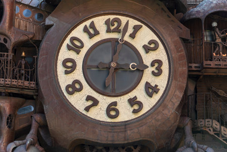 tokyo, japan - june 25 2021: Close up on the public art copper sculpture of the Ghibli Clock with...