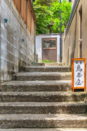 tokyo, japan - june 25 2021: Japanese lantern of the traditional restaurant Bettei Torijyaya on stairs of Kenban yokocho alley in the ancient red-light district of Ushigome Hanamachi in Kagurazaka.のeditorial素材