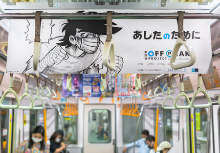 tokyo, japan - july 18 2021: Japanese banner in metro for preventing against coronavirus spread...