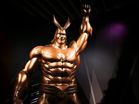 tokyo, japan - june 03 2021: Closeup on the bust of the golden statue depicting the superhero All Might raising his fist in the air at the exit of the My Hero Academia exhibition in Roppongi Hills.のeditorial素材