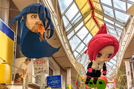tokyo, japan - august 05 2019: Paper-mache sculptures of Japanese anime characters from Zombie Land Saga and Kemurikusa hung in the Asagaya Pearl Center shopping street during Tanabata festival.のeditorial素材