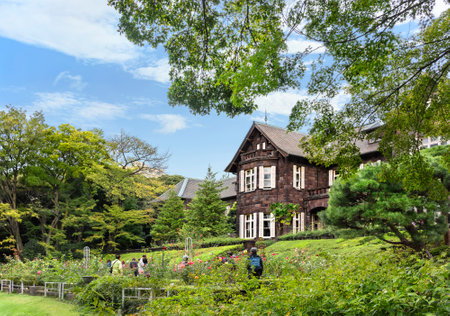 tokyo, japan - october 24 2021: Japanese tourists sightseeing the rose garden in front of the western-style mansion on the top of a hill of the KyÅ«-Furukawa Gardens designed by British architect Josiah Conder.のeditorial素材