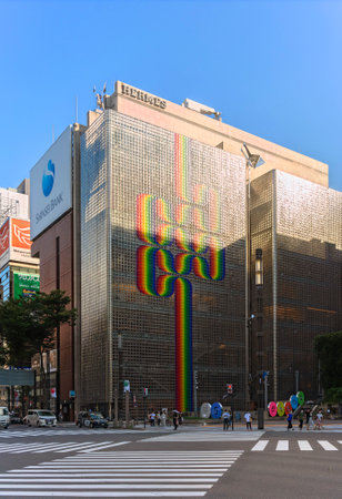 tokyo, japan - august 30 2021: Rainbow motif by Argentine artist Julio Le Parc on French luxury fashion brand HermÃ¨s building designed with translucent glass blocks by Renzo Piano at Ginza crossroad.のeditorial素材
