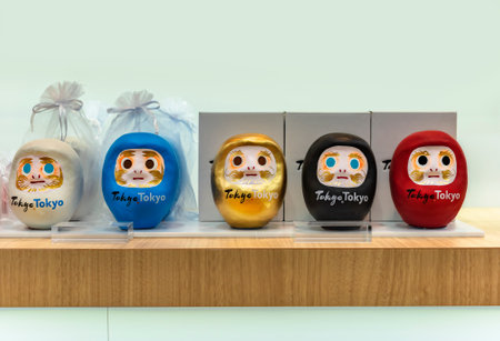 tokyo, japan - august 24 2021: Daruma dolls made of papier-mÃ¢chÃ© used as roly-poly toy or okiagari depicting the zen bodhidharma deity in a tourist office for promoting Japanese cultural diversity.のeditorial素材