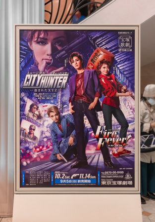 tokyo, japan - October 28 2021: Japanese Takarazuka Theater advertising poster depicting the all-female musical theater troupe featuring the manga and anime City Hunter or Nicky Larson in Yurakucho.のeditorial素材