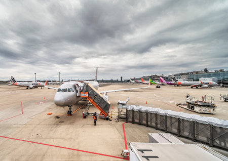 tokyo, japan - december 06 2021: Airbus plane from Japanese low-cost carrier airline jetstar airways boarding passengers on the apron or tarmac of the Narita international airport a cloudy day.のeditorial素材