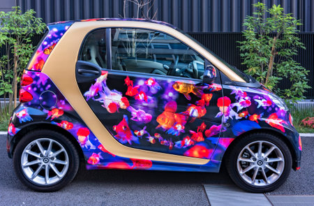 tokyo, japan - july 18 2021: Microcar of the brand called smart adorned with a vehicle vinyl wrap...