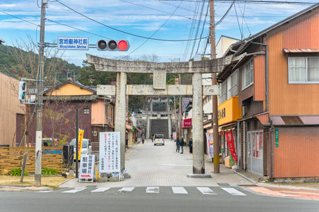 kyushu, japan - december 07 2019: Stone Torii portal at the entrance of Japanese shintoist Miyajidake Shrine SandÅ Shopping street leading to stairs called Path of lights dedicated to Empress JingÅ«.のeditorial素材