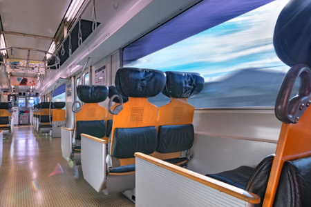kyushu, japan - december 10 2021: Interior of the commuter train of Kyushu railway company, the JR Kyushu BEC819 series with spacious leather and wooden seats moving around Nagasaki aera.のeditorial素材