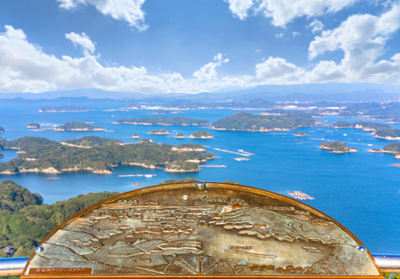 kyushu, japan - december 09 2021: Relief bronze map offered by the Sasebo Lions Club depicting the panorama bird's-eye view of the KujÅ«kushima seascape with islands that lie off Saikai National Park.のeditorial素材