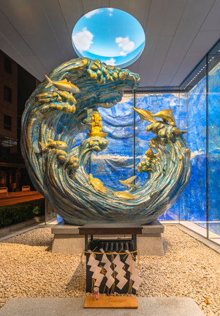 tokyo, japan - december 15 2021: Sculpture titled Sukunabikona-no-mikoto depicting Japanese fishermen god Ebisu sculpted by Ryohei Miyata in 2018 for the Kanda Myojin Cultural Exchange Center EDOCCO.のeditorial素材