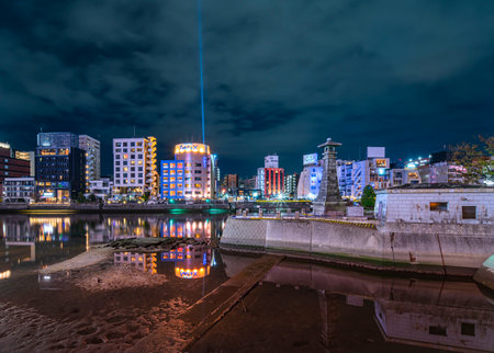 fukuoka, kyushu - december 06 2021: Stone lantern of Seiryu Park at night at the mouth of Hakata and Naka rivers commemorating the creation of ancient Mukoujima district by Rihei Yahiro in 1896.のeditorial素材