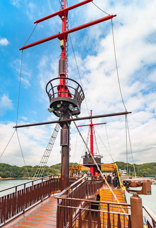 kyushu, japan - december 09 2021: Binocular in front of the main mast with a crown's nest on the electric Boat Mirai of the Kujukushima Pearl Sea Resort surrounded by the 99 islands in Sasebo city.のeditorial素材