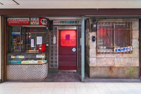 tokyo, japan - august 06 2022: Retro facade of a japanese cigarettes shop renovated as the Office Zingaro YokochÅ of famous pop artist Murakami Takashi in the corridor of Nakano Broadway Shopping Mall.のeditorial素材