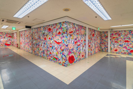tokyo, japan - august 06 2022: Corridor of Nakano Broadway Shopping Mall with closed shutters of the Tonari no Zingaro shop depicting kaikai-kiki characters of famous pop artist Murakami Takashi.のeditorial素材