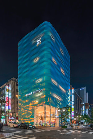 tokyo, japan - april 11 2023: Night view of the Louis Vuitton Ginza store building designed by...
