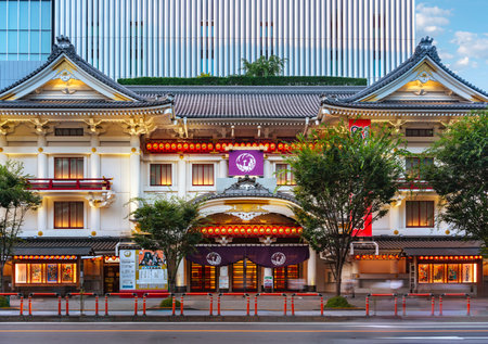 tokyo, ginza - july 25 2023: The white facade of the Kabukiza theater dedicated to the traditional kabuki drama form created in a Japanese architectural styles adorned with shining paper lanterns.のeditorial素材