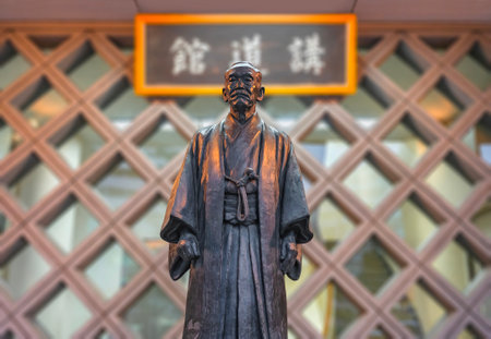 tokyo, japan - sep 17 2022: Statue of the founder of the sports discipline of Judo Kano Jigoro wearing a traditional kimono in front of the Kodokan Judo Institute famous among judoka around the world.のeditorial素材