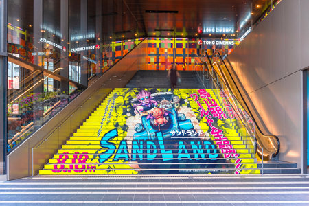 tokyo, ikebukuro - aug 22 2023: A stairs advertising at Toho Cinemas of the Japanese animated movie Sand Land with its hero Beelzebub illustrated by mangaka Akira Toriyama know also for Dragon Ball.のeditorial素材