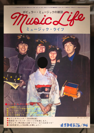tokyo, yurakucho - oct 27 2022: Photo stand-in of a Japanese Music Life magazine cover from 60' with the rock band The Beatles and a girl in kimono during their Japan Tour exhibit at a free exhibitionのeditorial素材