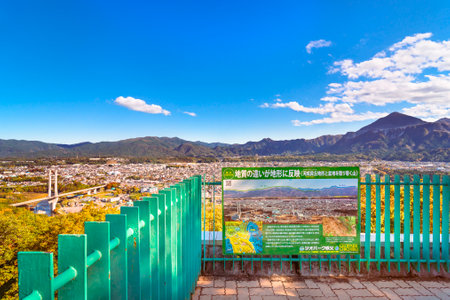 saitama, chichibu - Oct 2 2023: Chichibu Park Bridge called Harp Bridge with Mount BukÅ seen from the Muse Park viewing platform where a sign explains the topography and geology of Chichibu Geopark.のeditorial素材