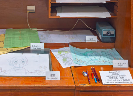 ikebukuro, japan - jan 16 2024: Animator desk exhibited at the free entry museum of Tokyo Anime Station featuring different stages of the creation of an animation illustrated with Astro boy character.のeditorial素材