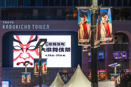 tokyo, japan - apr 28 2024: Street lamps lighting up the night of Kabukicho with pennants featuring Japanese actor Ryohei Suzuki as Ryo Saeba portrayed by Tsukasa HÃ´jÃ´ in the Netflix film "City Hunter".のeditorial素材