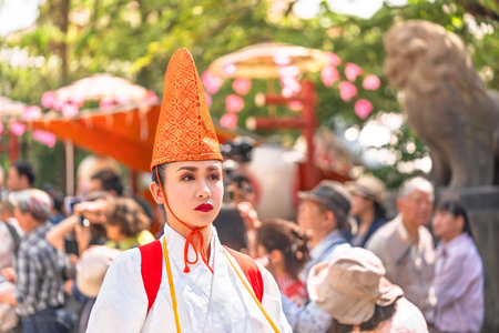 tokyo, asakusa - may 17 2024: A bust portrait of a Japanese lady in white heron dancer attire...