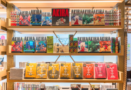 tokyo, ginza - may 17 2024: In the Japanese Ginza Six Mall's bookstore, a vibrant display of Katsuhiro Otomo's iconic manga Akira fills a bookshelf with other artworks like Fire-Ball or Highway Star.のeditorial素材